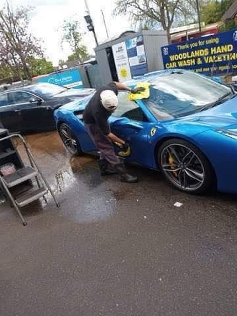 Our team hand washing a Ferrari at Woodlands
